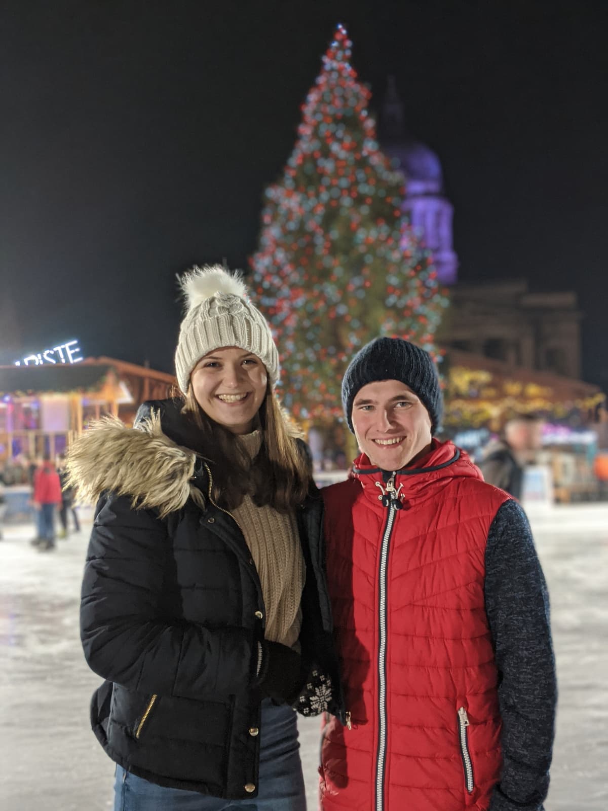 Us in front of a Christmas tree